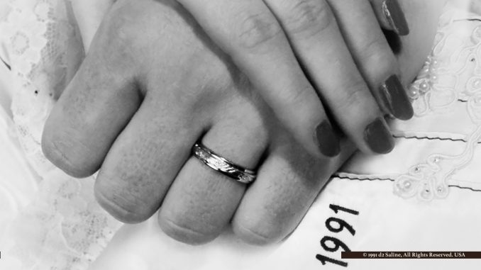 Wedding rings, holding hands in marriage