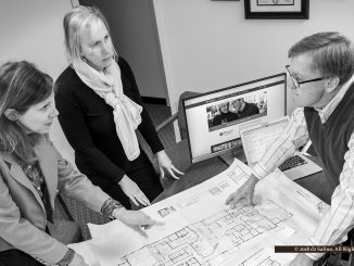 Janet Deaton, Emily Uphaus, and Mark Kuykendall discuss interior design for Best Western Premier hotel in Saline