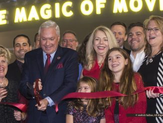 Paul Glantz, Chairman of Emagine Entertainment, cuts ribbon opening new theatre in Hartland Michigan