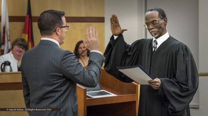 City of Saline Mayor Brian D Marl is sworn into office after re-election by Michigan District Court 14A Judge J Cedric Simpson, during January 7, 2018 City Council Meeting