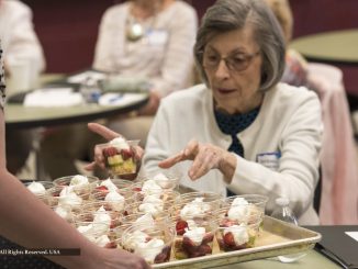 Serving strawberry shortcake at Saline Senior Center